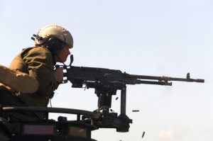 US Marine Corps (USMC) Corporal (CPL) Geddie from Headquarters Platoon, Charlie Company, 4th Light Armored Reconnaissance (LAR) Battalion, 4th Marine Division fires a turret ring mounted FNMI 7.62mm M240 Machine Gun from his Light Armored Vehicle (LAV-25) at range 407 on Camp Pendleton, California.