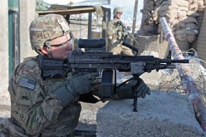 U.S. Army Pvt. Glen Rathwick, from Paso Robles, Calif., serving with 3rd Platoon, A Company, 3-1 Special Troop Battalion, El Paso, Texas, provides security at the main gate of an Afghan Uniformed Police station, Khoshi district, Logar province, Afghanistan, Jan. 25, 2012. (U.S. Army photo by Spc. Austin Berner / Released)