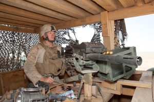 U.S. Marine Corps Lance Cpl. Matthew Faseler, with 1st Battalion, 23rd Marine Regiment, II Marine Expeditionary Force, keeps watch with a MK19 40 mm grenade launcher at Patrol Base Boldak, Helmand province, Afghanistan, Aug. 30, 2011. Faseler has a brother serving in the Marine Corps who is deployed to Afghanistan as well; the brothers are being profiled by the television show "60 Minutes." (U.S. Marine Corps photo by Lance Cpl. Justin Williams/Released)